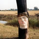 DEtail of 'Sleeping Head' 2003 Oil on limewood, charring. Height 1.72 m