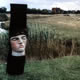 'Sleeping Head' 2003 Oil on limewood, charring. Height 1.72 m